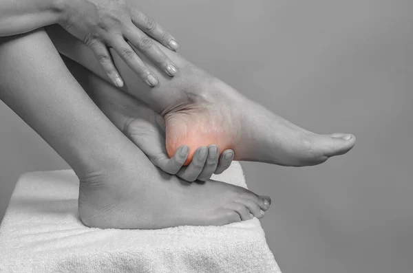 Female Hands Holding Foot Pain Heel Female Feet White Towel — Foto de Stock