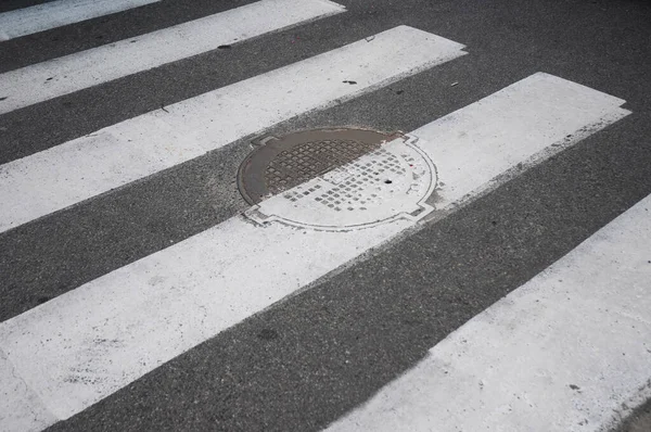 Repainted Pedestrian Crossing Manhole Cover — Stockfoto