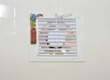 Bath fan repair, close up. Repair bath vent fan, ventilation system in the house bathroom . 