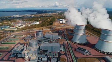Power units and cooling towers with steam and smoke from a nuclear power plant 