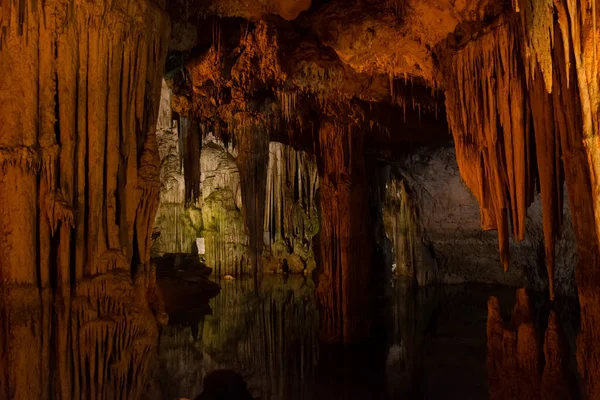 Alghero, Sassari , Italy; 3rd August 2022: Interior view of the cave of Neptune in cape caccia, Sardinia, italy. Partially undisturbed by the sea with stalagtites and stalagmites.