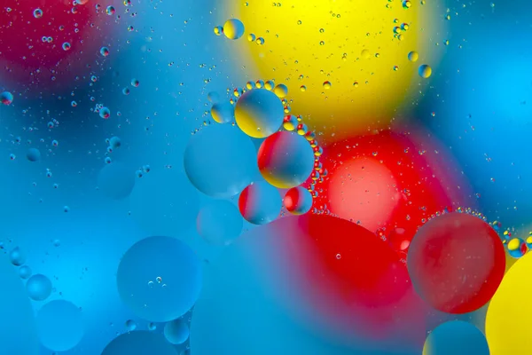 Gekleurde Druppels Olie Vloeistof Glas Abstractie Achtergrond Textuur — Stockfoto