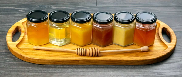 Hexagonal Jars Different Types Colors Fresh Flower Honey Honey Spoon — Stock Photo, Image