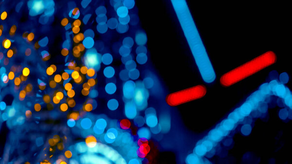 Background blurred abstraction of colored lanterns and decorations. bokeh texture of street colored lights
