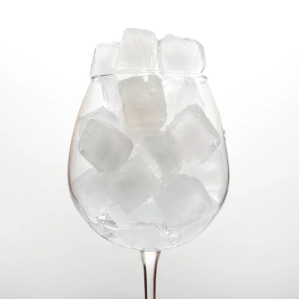 Frozen Ice Cubes Empty Wine Glass Light Background — Stock Photo, Image