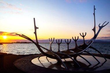 Sun Voyager monument in Reykjavik against the backdrop of sunset . Iceland. Travel and tourism. Architecture and famous cities of Europe