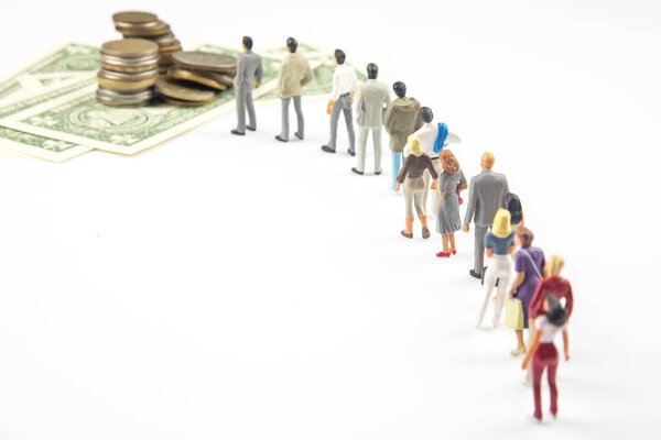 miniature people. different businessman stands near dollar money. investments and earnings for work