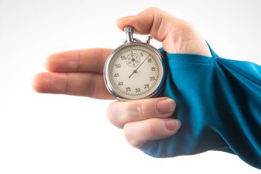 hand with finger direction pointer and mechanical stopwatch on white background. Time part precision. Measuring the speed interval with a watch