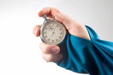 hand with a mechanical stopwatch on a white background.