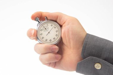 hand with a mechanical analog stopwatch on a white background. Time part precision. Measurement of the speed interval