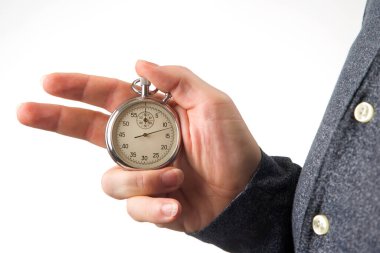 hand with a mechanical stopwatch on a white background.