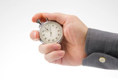 hand with a mechanical analog stopwatch on a white background. Time part precision. Measurement of the speed interval