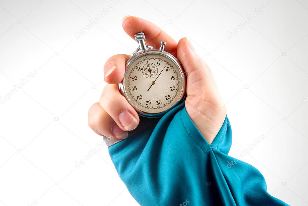 hand with a mechanical stopwatch on a white background.