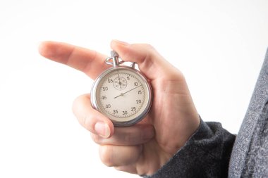 hand with a mechanical stopwatch on a white background.