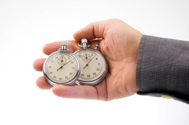 Two mechanical stopwatches in a male hand. Time part precision. Measurement of the speed interval