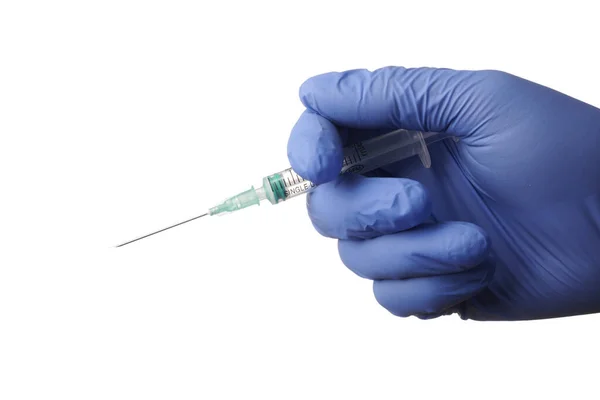 Isolated Gloved Hand with Syringe - Photo on a White Background. — Foto Stock