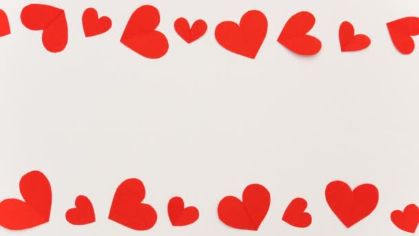 コピースペース付きのバレンタインと愛のコンセプトのための赤い紙の心のフレームストップモーション — ストック動画