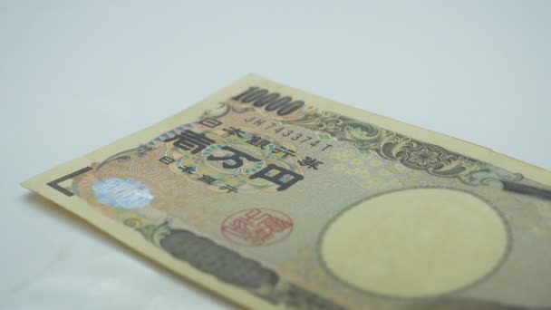 Liczenie Japońskich Banknotów Pieniężnych Białym — Wideo stockowe