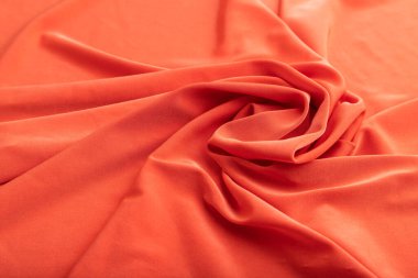 Kırmızı keten doku parçası. Yan görünüş, doğal tekstil arka plan ve doku. dalga konsepti, soyut, sarmal biçim.