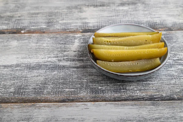 Marinated Cucumber Blue Ceramic Plate Gray Wooden Background Side View — Stock Photo, Image