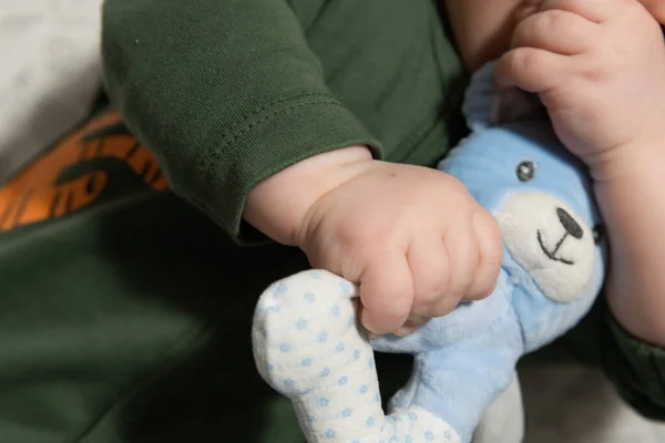 Small Three Month Old Baby Holds Soft Toy His Hands — Fotografia de Stock