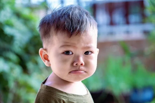 Asian child sad