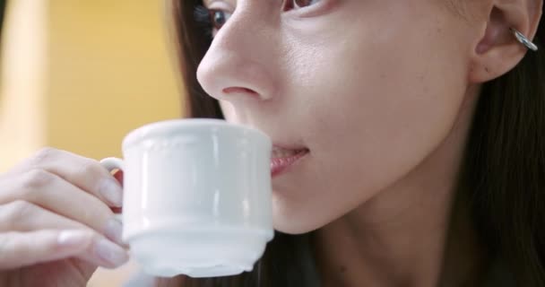 Close up of satisfied woman drinking tea on kitchen. lady enjoying cup of coffee — Video Stock