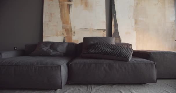 The modern minimalist living room with black and gray tone, large paintings — Stock Video