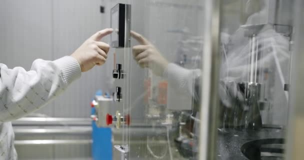 A Man hand works on the machine and presses his finger on a touch display device — Stock Video