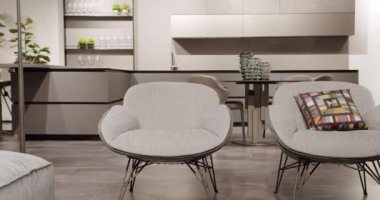 Modern Minimalist Home. Modern black lamp. Modern gray, white kitchen furniture.