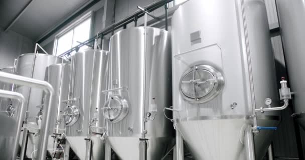 Huge stainless vats in a brewery. Equipment for beer fermentation. Factory — Stock video