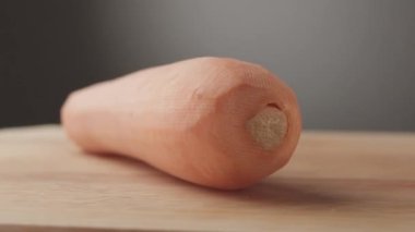 Carrot on wooden board. macro shot. Detail Carrot. vegetarian food detail. Food Preparing with Vegetable Delicious food.
