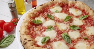 Pizza Margherita. Italian cuisine. Neapolitan Margherita Pizza, Margherita Pizza Topped with Melted Mozzarella Cheese. Fresh Delicious Food. Organic Cuisine. Restaurant Pizza Food.
