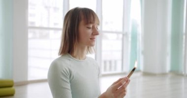 Woman meditating with Palo Santo, holy wood, relaxation zen practice in studio, herbal healing, yoga or aura cleaning. Bursera Graveolens. Essential incense for esoteric rituals.
