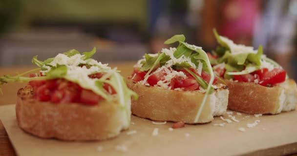 Delicious Bruschetta Sourdough Toast Cherry Tomatoes Cheese Arugula Traditional Italian — Stockvideo