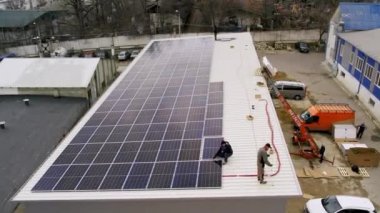 Technician installing solar panels on house roof. Concept.renewable energy, technology, electricity, service, green, future. power plant. Modern solar panels produce clean electricity. 
