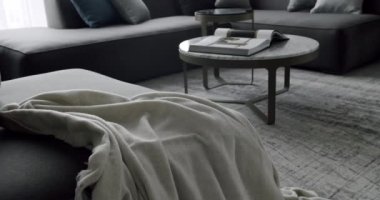 Luxury Modern House Interior With Corner Sofa round table. Fashionable furniture. Minimalist Home Interior. Modern contemporary Minimalist living room with gray furniture.
