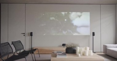 Oturma odası. Lüks minimalist tasarım, beyaz ve gri tonlu gerçek daire, zarif sandalye, lüks mobilya, projektör, duvarda televizyon ve siyah ses teknikleri, beton, minimalist tasarım.