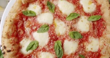 Close Up zoom Neapolitan Margherita Pizza, Margherita Pizza Topped with Melted Mozzarella Cheese. Fresh Delicious Food. Organic Cuisine. Restaurant Pizza Food. Pizza Margherita. Italian cuisine. 