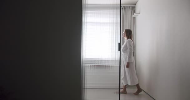 Woman Robes Open Transparent Sliding Door Modern Bathroom Minimalist Bathtub — Stockvideo