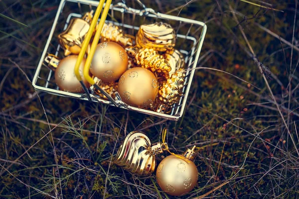 Golden Christmas Tree Toys Shopping Basket Natural Mossy Background Festive — Stock Photo, Image