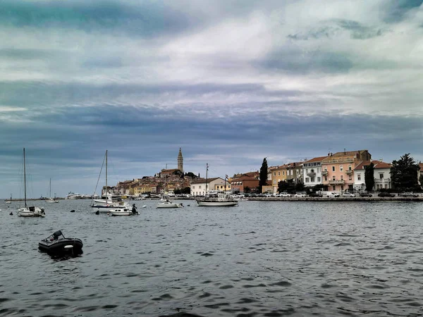 Rovinj seaview with yachts and boats on Adriatic Sea under cloudy sky on croatian seaside in summer