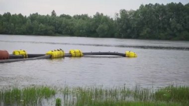 Pumping sand on the river. Water pump and pipes on the water