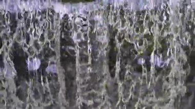 Old dam on the river. Close-up footage of the waterfall.