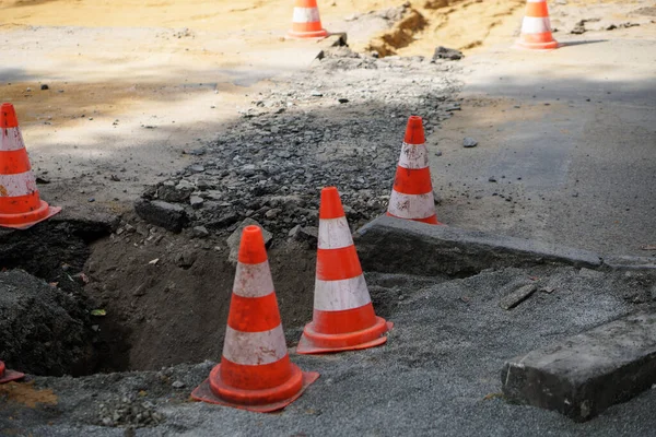 Road cone. Construction and repair of the road on the street. Precaution sign.