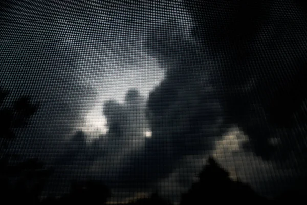 Stormy sky with dark gray clouds. Photo background, dark texture