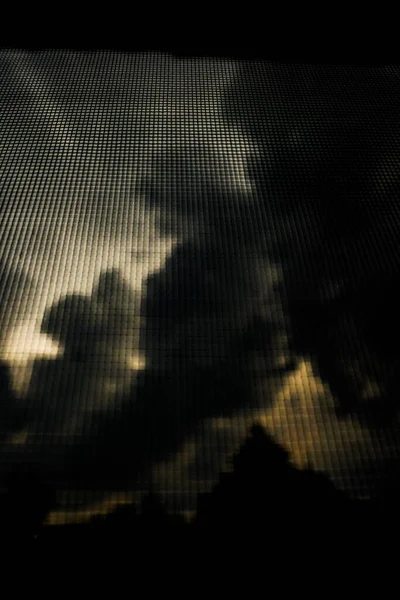 Stormy sky with dark gray clouds. Photo background, dark texture
