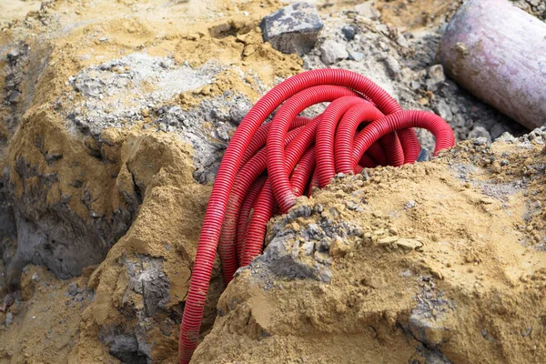 Red Corrugated Flexible Plastic Pipe Cable Ducts Repair Work Stock Picture