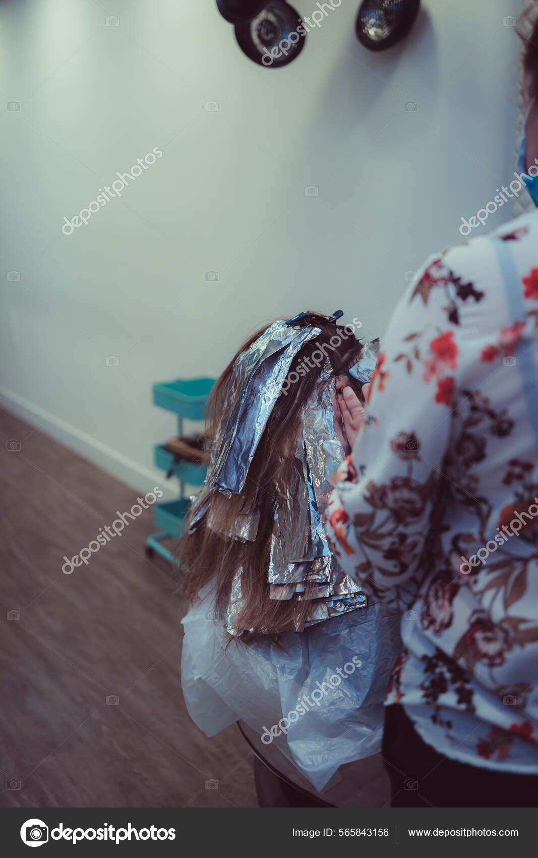 Woman dyes her hair in a the process of dyeing her hair