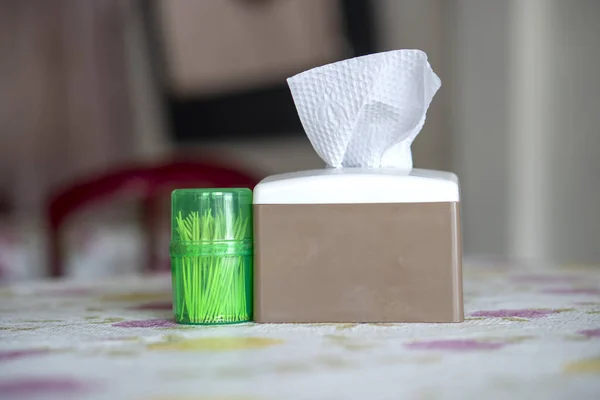 Tissue box and toothpick in food court on the table background.